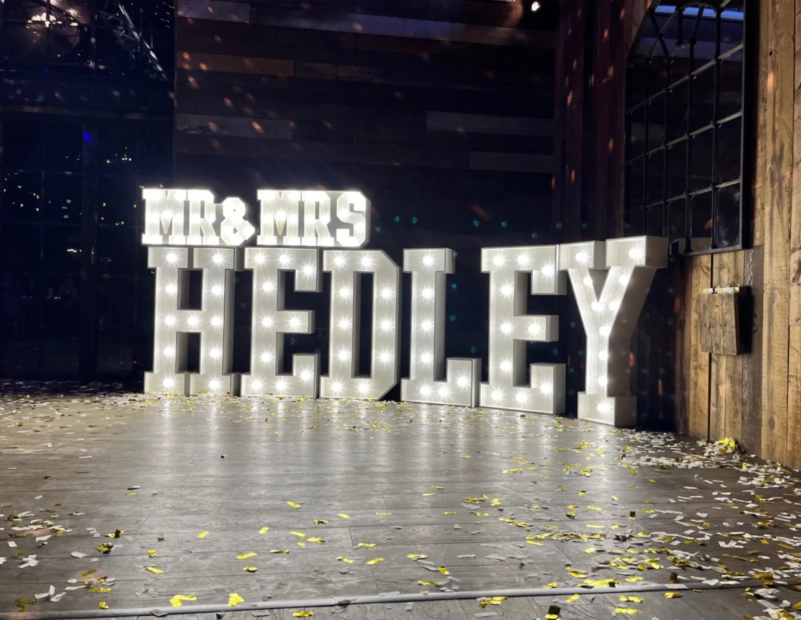 White MR & MRS HEDLEY light up letters in a hotel