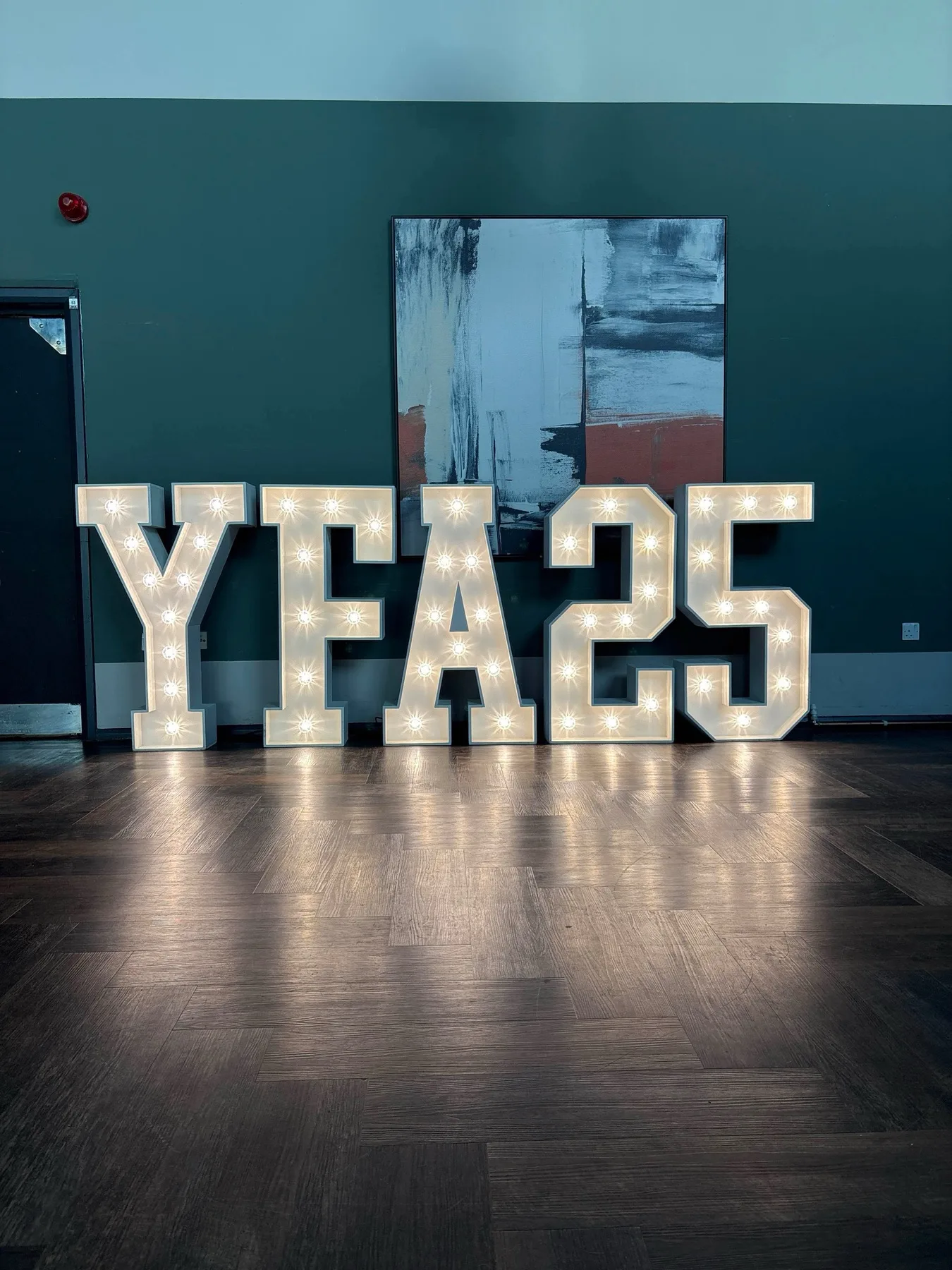 White light up letters spelling YFA25